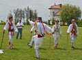 Men performing traditional romanian Calusari dance