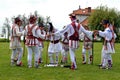 Men performing traditional romanian Calusari dance