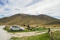 Men photographer travel in Lindis pass in New Zealand road trip Royalty Free Stock Photo