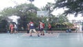 Shenzhen, China: men play basketball as a recreational sport.