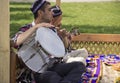 men play national musical instruments