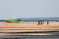 Men play soccer at the beach in Mozambique.