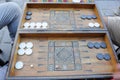 Men playing backgammon board game with an old wooden table, checkers and dice in Turkey Royalty Free Stock Photo