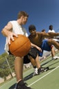 Men Playing Basketball On Court Royalty Free Stock Photo