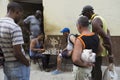 Men playing chess under the watchful eye of other men in Old Havana