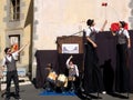 Men playing diabolo on stilts. Royalty Free Stock Photo