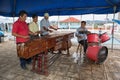 Men playing marimba music on the street in Flores Guatemala