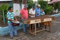 Men playing marimba music on the street of Flores Guatemala