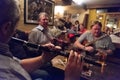 Men playing music instruments in an Irish pub in Doolin, Ireland Royalty Free Stock Photo