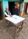 Men playing typical nepalese desk game Carryam board