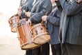 Men playing a typical percussion instrument of the celebration of the Fallas of Valencia, called