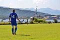 Men playing typical scottish team game shinty with sticks and ball