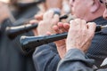 Men playing a typical wind instrument of the celebration of the Fallas of Valencia, called