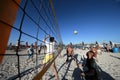 Men playing volleyball on the beach