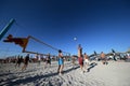 Men playing volleyball on the beach