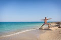 Men practicing yoga on the beach in Greece, in position wa