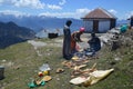 Men preparing halwa-puri on hillside Royalty Free Stock Photo