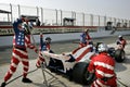 Men preparing a race car