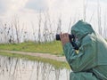Men in a protective suit looks into binoculars Royalty Free Stock Photo