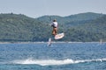 Men pursuing watersports in the sea off Viganj Royalty Free Stock Photo