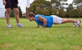 Men, push up and personal trainer on field for exercise with counting for stats, progress or development. Person, coach Royalty Free Stock Photo