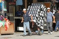 Men pushing a trolley Royalty Free Stock Photo