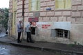 Men queue up to buy bread from a bakery in the old town of Tbilisi, Georgia Royalty Free Stock Photo