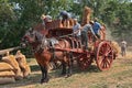 Wheat threshing with ancient equipment during the country fair Royalty Free Stock Photo