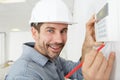 men regulate temperature on control panel central heating Royalty Free Stock Photo