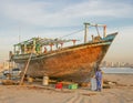 Workers Renovating a Wooden Dhow