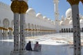 Men rest at a mosque in Abu Dhabi