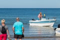 Men returning from a sea fishing competition