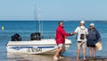 Men returning from a sea fishing competition