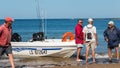 Men returning from a sea fishing competition