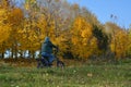 Men riding on a bike autumn landscape in the Minsk city Belarus