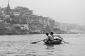 Men in row boat in Varanasi, India Royalty Free Stock Photo