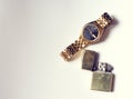 Men's accessory, golden watch and lighter on white
