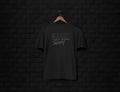 Men's black short sleeve t-shirt mockup in black wall surface with dark bricks. Front view. Vector.