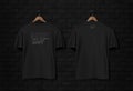 Men's black short sleeve t-shirt mockup in black wall surface with dark bricks. Front view.