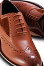 Men`s brown brogue leather shoes on a white background