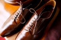 Men`s brown shoes made of genuine leather with laces close-up. Royalty Free Stock Photo