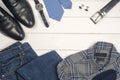 Men's casual clothes and accessories on wooden background