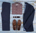 Men`s casual outfits for men clothing set with shoes, trousers, shirt on wooden background, Top view Royalty Free Stock Photo