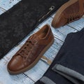 Men`s casual outfits for man clothing set with shoes, trousers, shirt on wooden background, Top view Royalty Free Stock Photo