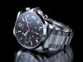 Men`s chrome wristwatch on black background