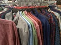 Men`s clothes in hangers rack. Royalty Free Stock Photo