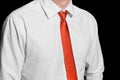 Men's clothing style fashion business look white shirt and red tie close-up on black dark background, soft focus Royalty Free Stock Photo