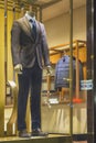 Men`s dummy in a suit in a show-window of shop