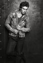 Men`s fashion portrait. Young handsome man posing in denim jacket Royalty Free Stock Photo