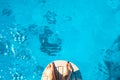 Men`s feet on the bow of the ship. A man is preparing to jump into the clean blue sea. Royalty Free Stock Photo